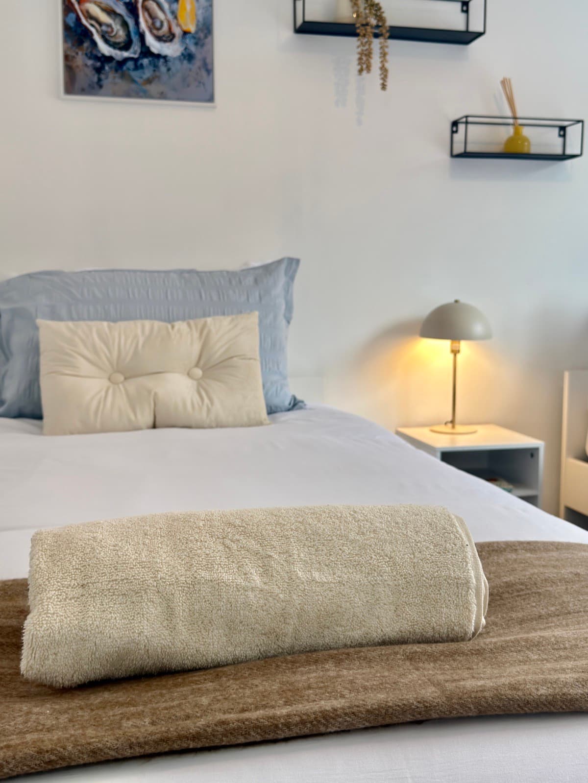 The Barrows — folded towels on a made-up bed
